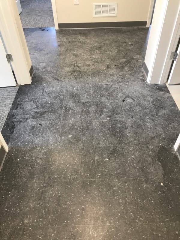 Dull black stone floor before