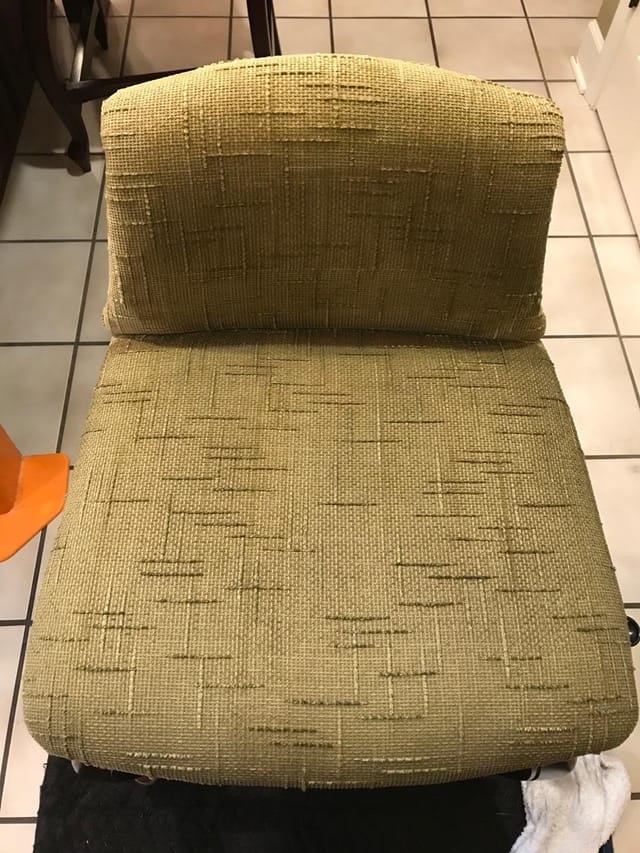 Red stain on a chair cushion after