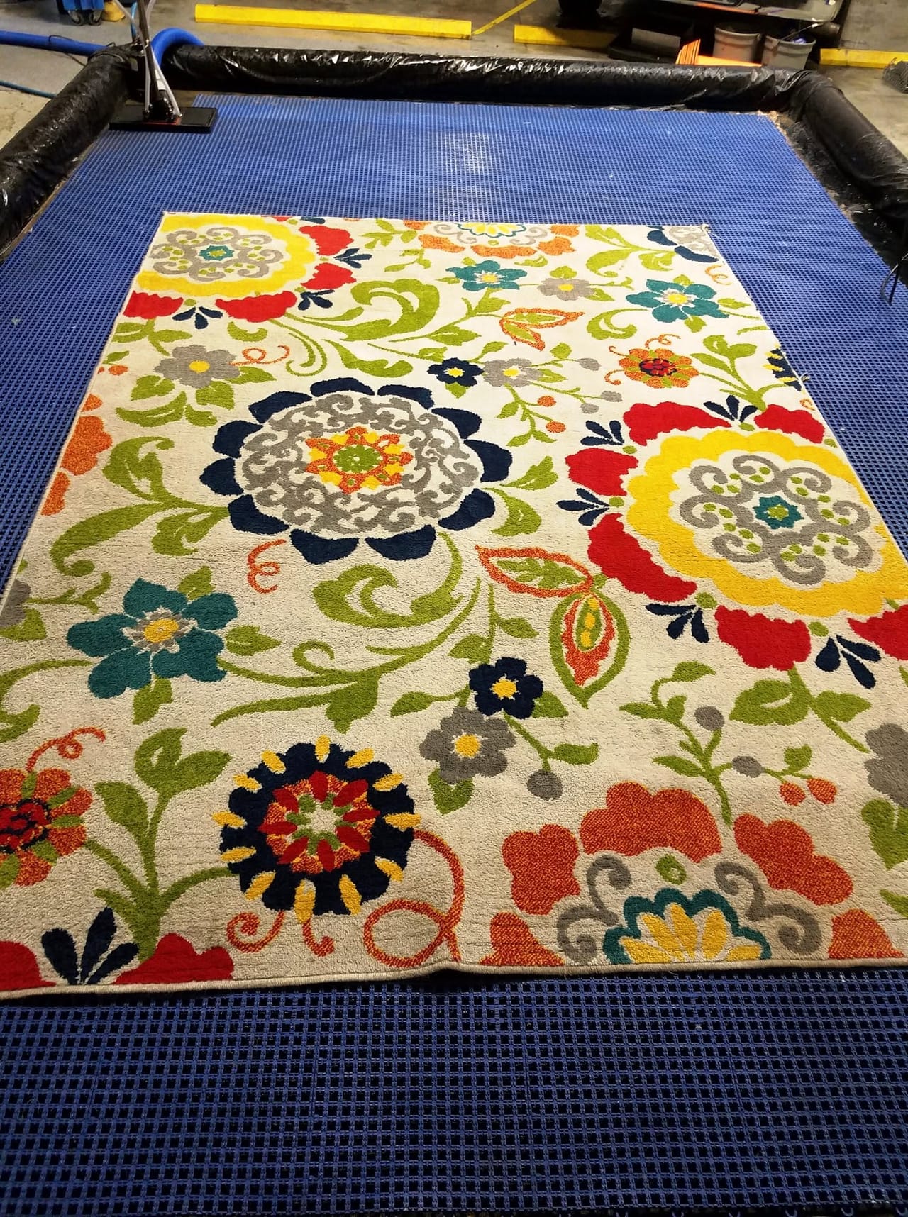 Floral rug in the wash pit after