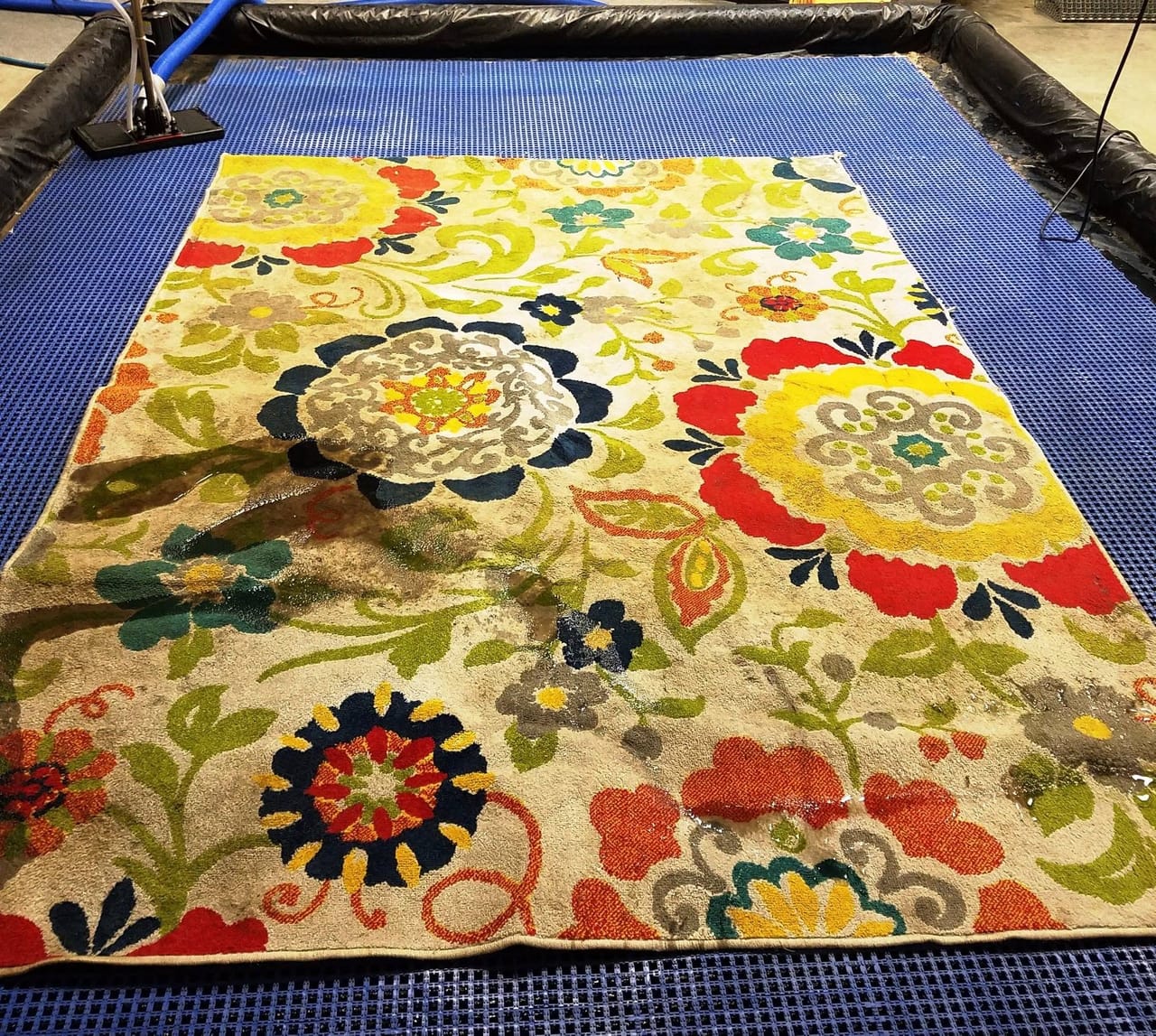 Floral rug in the wash pit before