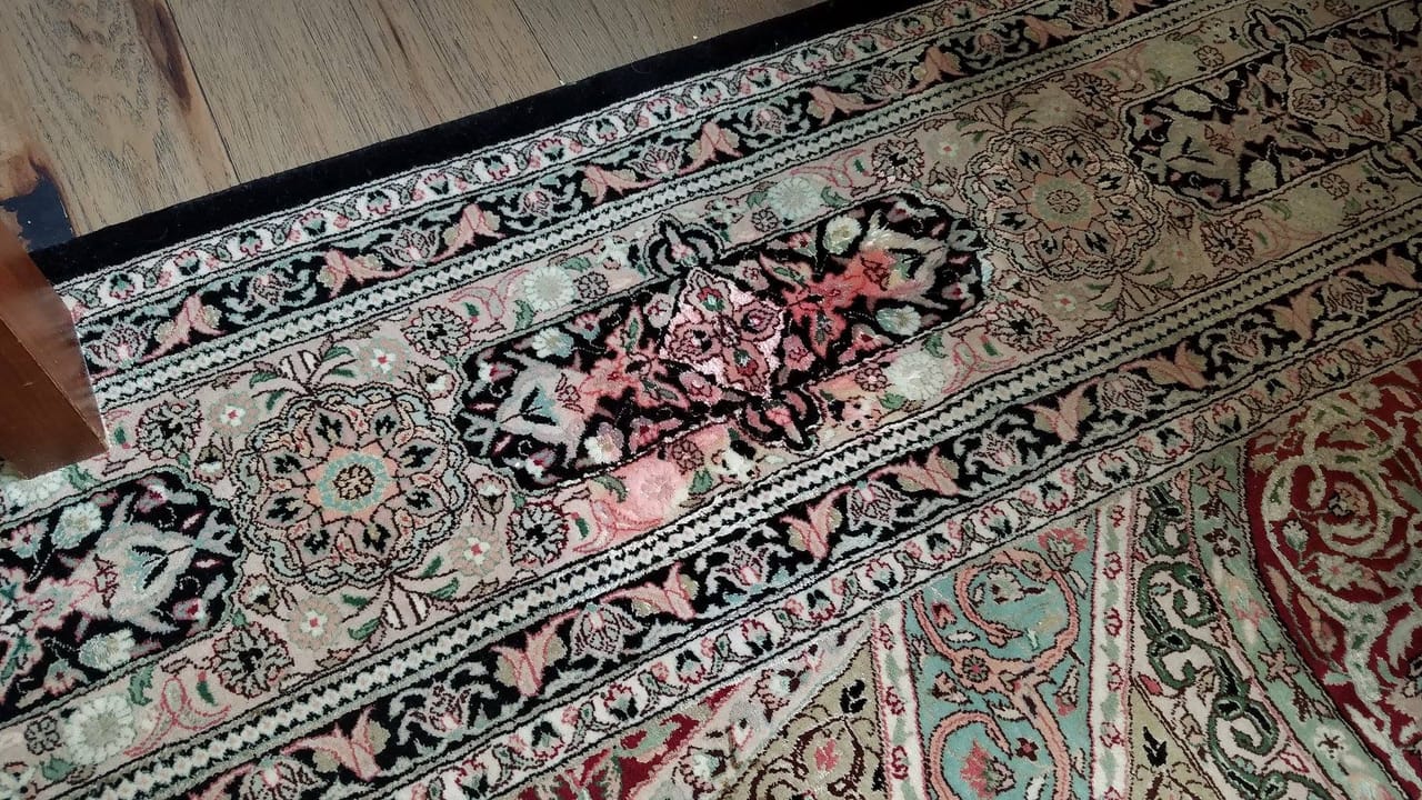 Stain on an oriental rug before