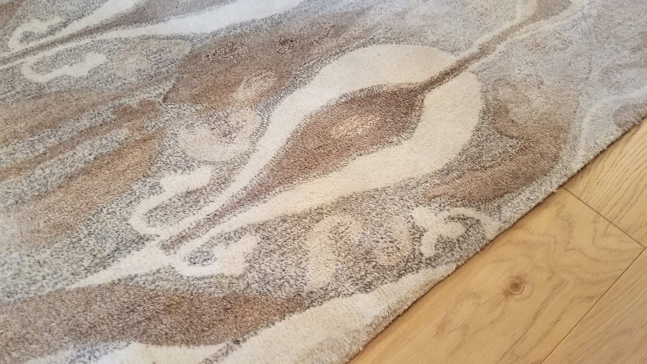 Pink stain on an area rug after