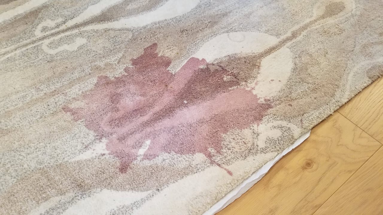 Pink stain on an area rug before
